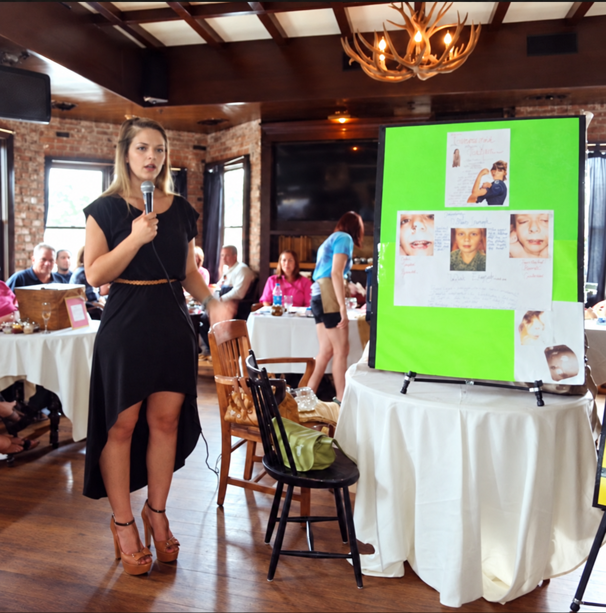 Kasha sharing her story with a handheld microphone